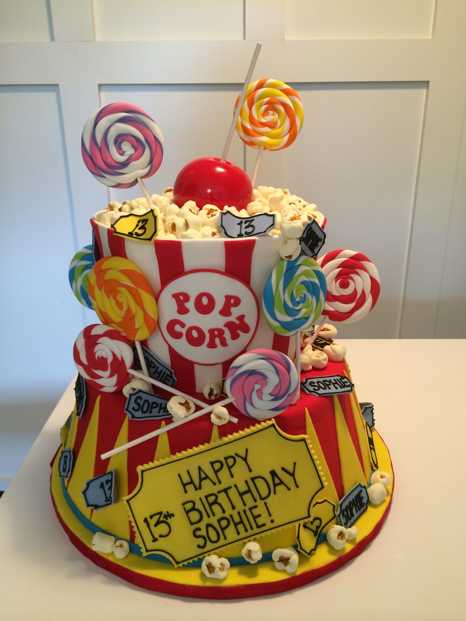 Carnival popcorn and lollipop birthday cake